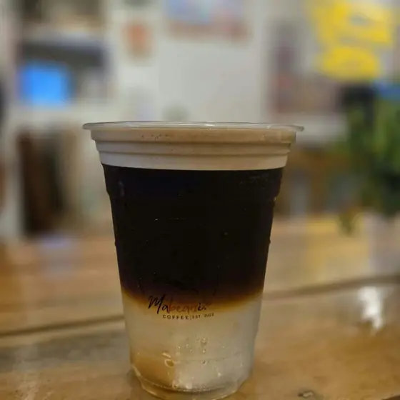 A layered iced espresso drink