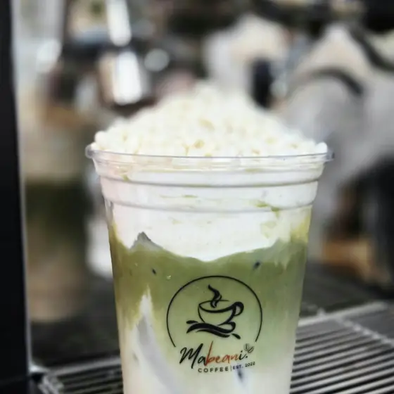 Iced matcha with cream and white pearls