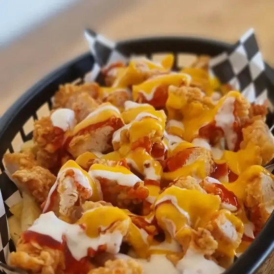 Chicken pops drizzled with sauces