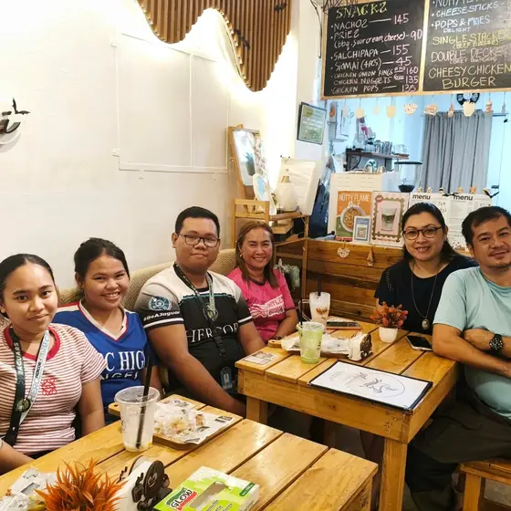 A family enjoying drinks and snacks