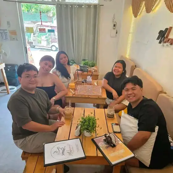 A group of friends sharing drinks at Mabeani Coffee